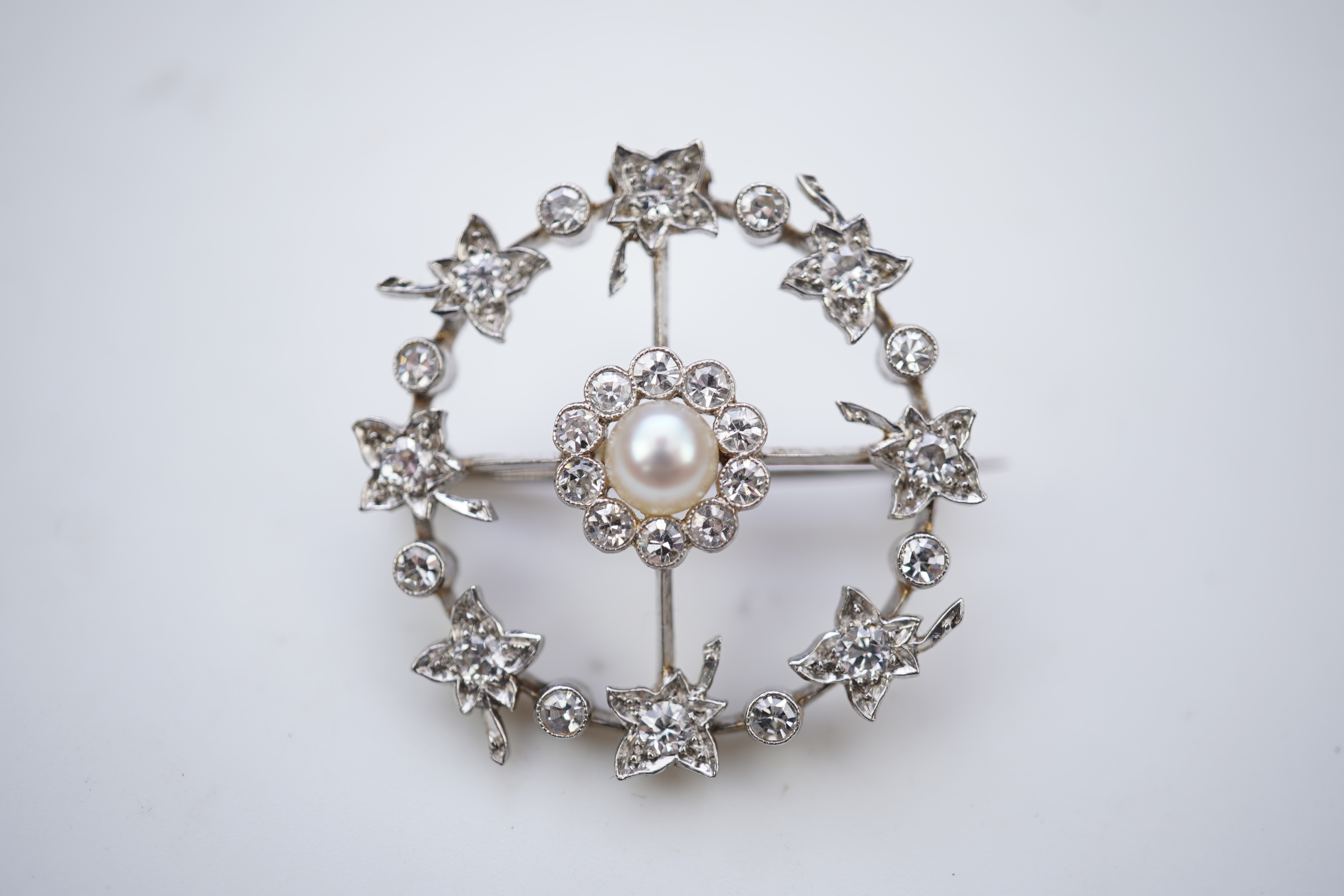 An attractive Edwardian pearl and diamond brooch, circa 1910